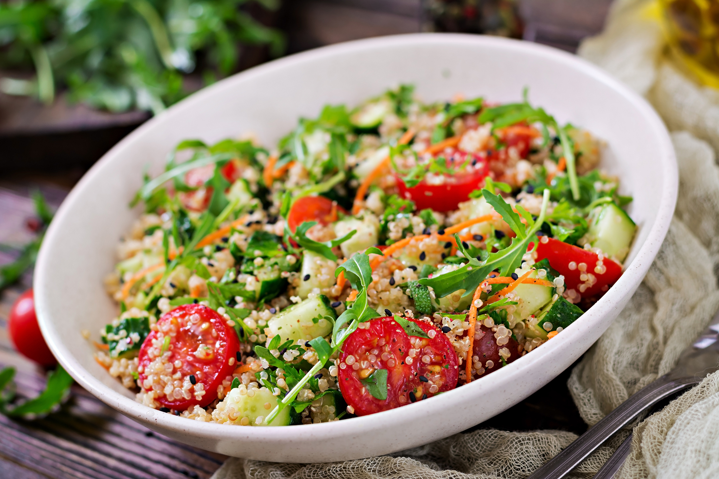 https://www.quadcitiesbusinessnews.com/wp-content/uploads/2023/04/salads-with-quinoa-arugula-radish-tomatoes-cucumber-bowl-wooden-table-healthy-food-diet-detox-vegetarian-concept.jpg